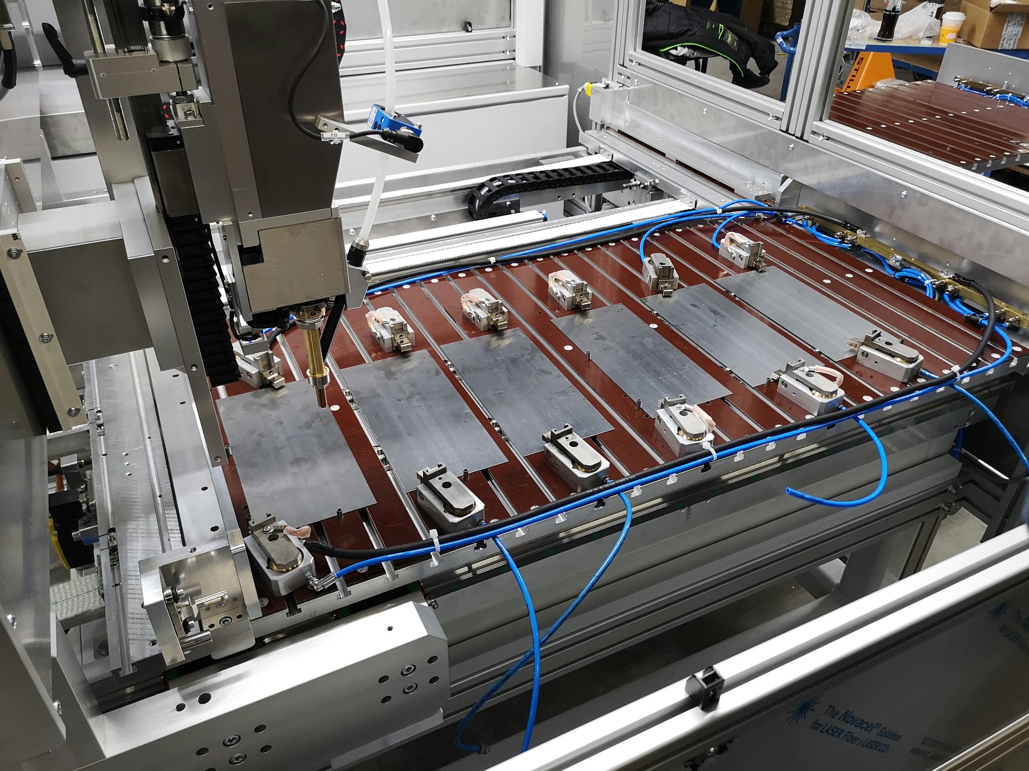 Welding head and workpiece fixture in the work area.