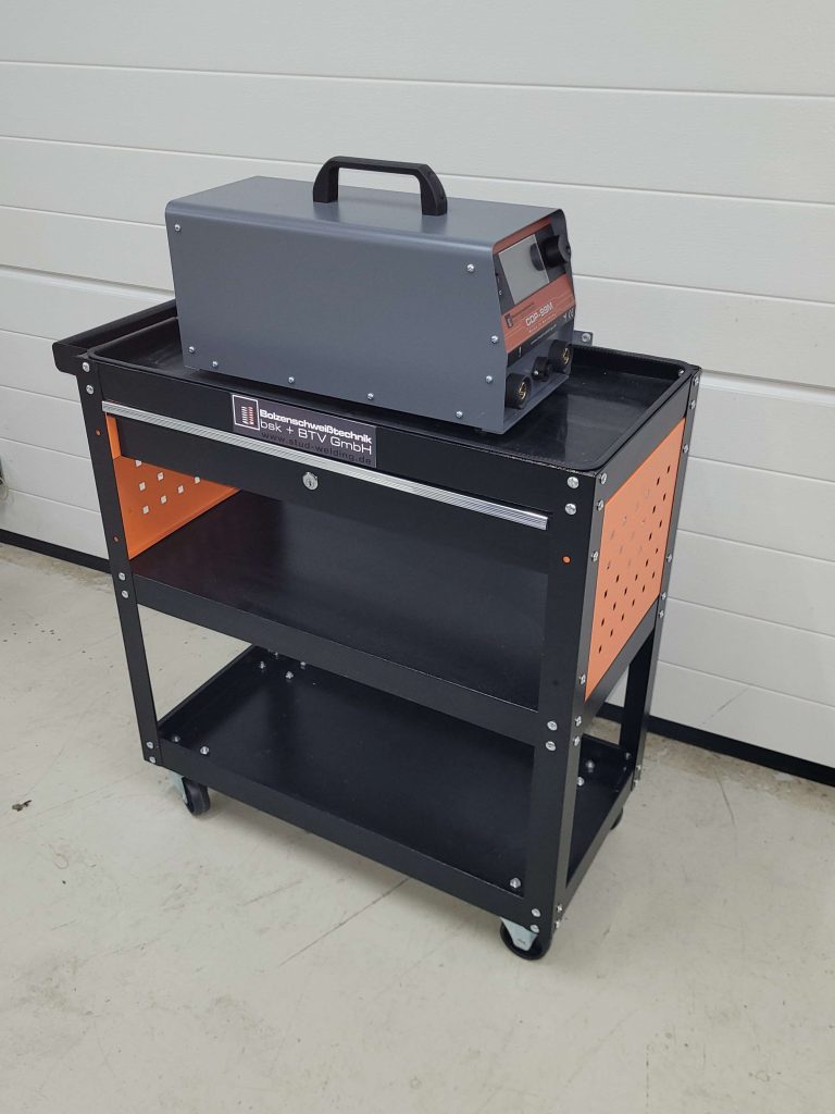 Equipment trolley in an angled view with a CDP welding unit on the top shelf